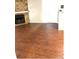 An open living room area with hardwood floors and a stone fireplace at 18193 E Kentucky Ave # 201, Aurora, CO 80017