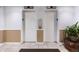 Photo of the entrance to the elevators with tile flooring and wainscoting at 1265 Race St # 208, Denver, CO 80206