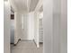 Bright hallway with ceramic tile flooring leading to the bathroom and kitchen at 1265 Race St # 208, Denver, CO 80206