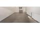 Spacious living room with natural light, featuring modern flooring and neutral walls at 1265 Race St # 208, Denver, CO 80206