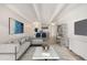 Staged living room offering a stylish design with sleek furnishings and inviting decor at 1265 Race St # 208, Denver, CO 80206