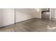 Large living room that flows into kitchen. Offers an open floor plan with modern flooring and neutral decor at 1265 Race St # 208, Denver, CO 80206