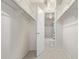 Good size walk-in closet with shelving looking into the remodeled bathroom at 1265 Race St # 208, Denver, CO 80206