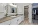 Modern bathroom with marble countertop, walk in closet, and tiled shower at 292 Summerwood Ln, Castle Pines, CO 80108
