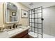 Modern bathroom with sleek vanity, stylish mirror, and glass-enclosed shower at 292 Summerwood Ln, Castle Pines, CO 80108