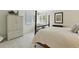 Bright bedroom with plantation shutters, neutral carpet, and a stylish armoire at 292 Summerwood Ln, Castle Pines, CO 80108