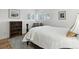 Bright bedroom featuring a comfortable bed, shuttered windows, and stylish decor at 292 Summerwood Ln, Castle Pines, CO 80108