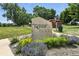 Beautiful community park entrance sign with colorful flowers and landscaping at 292 Summerwood Ln, Castle Pines, CO 80108