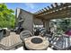 A view of the deck and pergola with multiple seating areas and a barbecue grill at 292 Summerwood Ln, Castle Pines, CO 80108