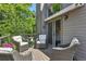 Relaxing deck area with comfortable seating and lush greenery offering private outside entry to main bedroom at 292 Summerwood Ln, Castle Pines, CO 80108