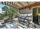 A spacious deck with a dining table, barbecue, and view of the house's exterior at 292 Summerwood Ln, Castle Pines, CO 80108