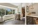 Sunny dining area features a large window and access to dining room at 292 Summerwood Ln, Castle Pines, CO 80108