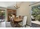 Dining room featuring wood table set and sliding glass door to outdoor patio at 292 Summerwood Ln, Castle Pines, CO 80108