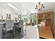 Dining room featuring a wood table set with an island separating kitchen area at 292 Summerwood Ln, Castle Pines, CO 80108