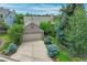 Charming home featuring a two-car garage and lush, mature landscaping at 292 Summerwood Ln, Castle Pines, CO 80108