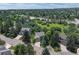 Exterior view of several homes surrounded by mature trees in a desirable location at 292 Summerwood Ln, Castle Pines, CO 80108