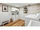 Functional laundry room with ample storage, modern appliances, and durable flooring at 292 Summerwood Ln, Castle Pines, CO 80108
