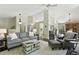 Spacious living room with comfortable seating and seamless flow into other areas of the home at 292 Summerwood Ln, Castle Pines, CO 80108