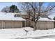 Front view of townhome with double garage at 1470 S Quebec Way # 83, Denver, CO 80231