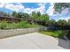 Landscaped backyard includes a garden bed, wood fence, and concrete patio perfect for entertaining at 4786 S Yampa St, Aurora, CO 80015