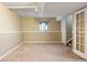 Basement area with carpet, a window, baseboard heating, and neutral walls at 4786 S Yampa St, Aurora, CO 80015