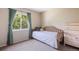 Cozy bedroom featuring a comfortable daybed with natural light from the window at 4786 S Yampa St, Aurora, CO 80015