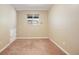 Bedroom featuring carpet, a window, baseboard heating, and neutral walls at 4786 S Yampa St, Aurora, CO 80015