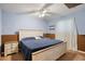 Cozy bedroom featuring a queen-size bed, neutral walls, and soft carpet at 4786 S Yampa St, Aurora, CO 80015
