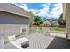 A view of the outdoor deck and backyard featuring plenty of space for lounging and entertaining at 4786 S Yampa St, Aurora, CO 80015