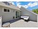 Outdoor living area features a cozy seating area and patio door access to the home's interior at 4786 S Yampa St, Aurora, CO 80015