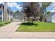 Charming single-Gathering home with a well-kept lawn and mature tree provides shade and curb appeal at 4786 S Yampa St, Aurora, CO 80015