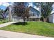 Charming two-story home with well-manicured lawn, mature tree, and attached two-car garage at 4786 S Yampa St, Aurora, CO 80015
