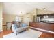 Open concept living room flows into the kitchen and dining area, with lots of natural light and vaulted ceiling at 4786 S Yampa St, Aurora, CO 80015