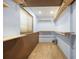A neatly organized walk-in closet providing ample storage space with shelving at 4786 S Yampa St, Aurora, CO 80015