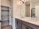 Modern bathroom with dual vanity sinks and a walk-in shower at 804 W 128Th Pl, Westminster, CO 80234