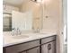 Elegant bathroom featuring dual sinks and a large mirror at 804 W 128Th Pl, Westminster, CO 80234