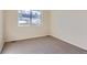 Well-lit bedroom featuring carpet floors and a window at 804 W 128Th Pl, Westminster, CO 80234