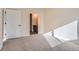 Sunny bedroom with carpet floors and an en-suite bathroom at 804 W 128Th Pl, Westminster, CO 80234