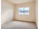 Bright bedroom with carpet flooring and a large window offering natural light at 804 W 128Th Pl, Westminster, CO 80234