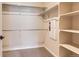 Large walk-in closet with double hanging rods and shelving at 804 W 128Th Pl, Westminster, CO 80234