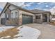 Craftsman style home with stone accents, two-car garage, and covered entry at 804 W 128Th Pl, Westminster, CO 80234