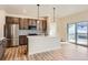 Open concept kitchen with island and stainless steel appliances at 804 W 128Th Pl, Westminster, CO 80234