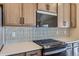 Modern kitchen with a gas cooktop and sleek cabinetry at 804 W 128Th Pl, Westminster, CO 80234