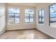 Sunroom with large windows and hardwood floors at 804 W 128Th Pl, Westminster, CO 80234