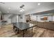 Finished basement with ping pong table, bar, seating area, and wood-look floors at 188 S Rogers Way, Golden, CO 80401