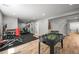 Spacious finished basement area featuring a gym, foosball table, and wood-look floors at 188 S Rogers Way, Golden, CO 80401