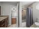 Bathroom featuring granite countertops, a tub, and tiled shower at 188 S Rogers Way, Golden, CO 80401