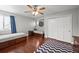 Bright bedroom with hardwood floors, ceiling fan, and built-in single beds at 188 S Rogers Way, Golden, CO 80401