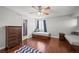 Cozy bedroom featuring hardwood floors, ceiling fan, and two built-in beds at 188 S Rogers Way, Golden, CO 80401