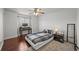 Cozy bedroom with hardwood floors, a ceiling fan, and a dedicated desk area, perfect for work or study at 188 S Rogers Way, Golden, CO 80401